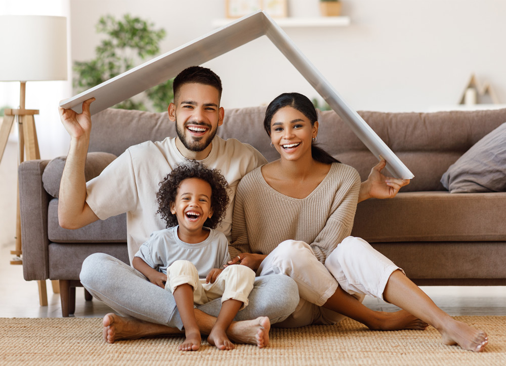 Photo of a young family in their home