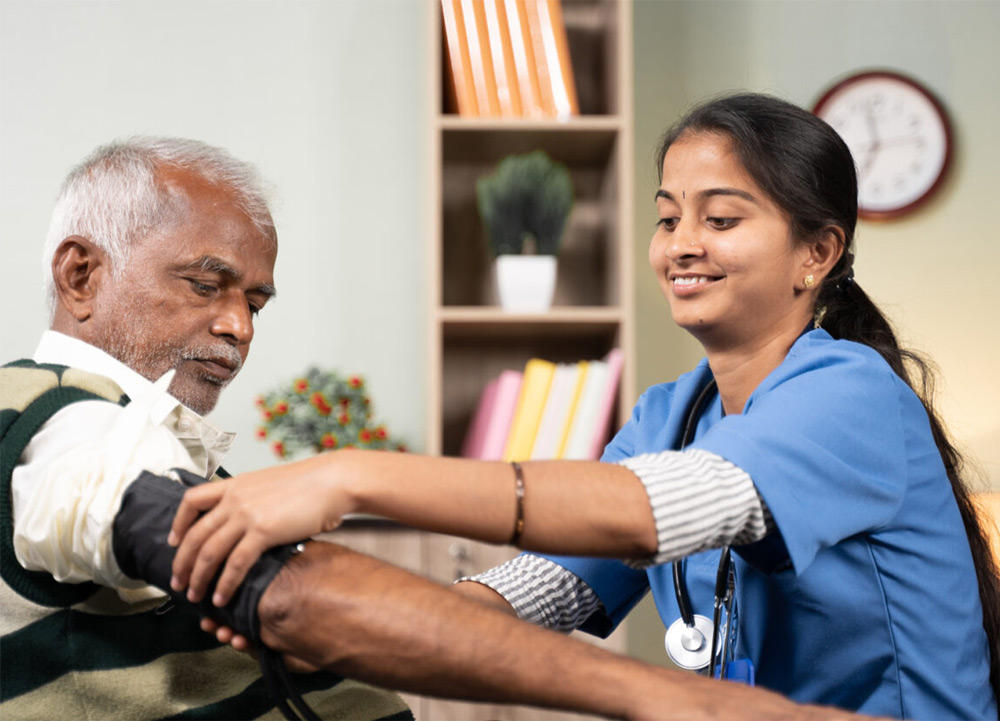 Medical technician taking a patient's blood pressure reading